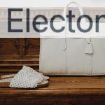 white leather handbag on brown wooden table