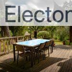 brown wooden table with chairs and umbrella